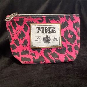 Small pink makeup bag. Good for everyday use or vacationing.